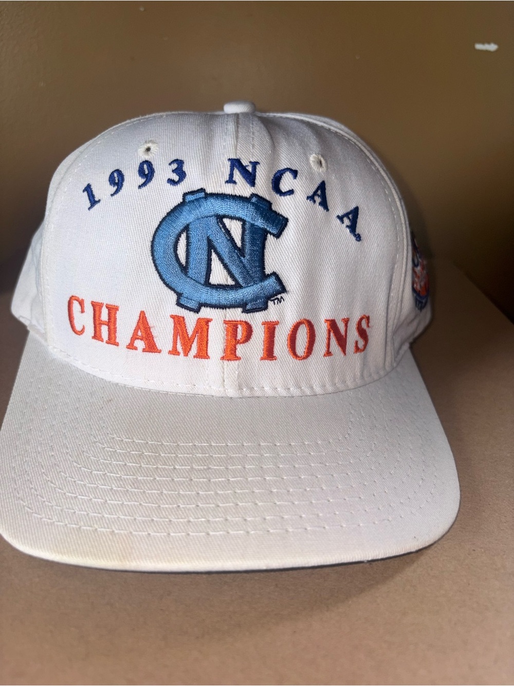 1993 NCAA North Carolina Champions White Cap with Blue Logo and Orange Lettering
